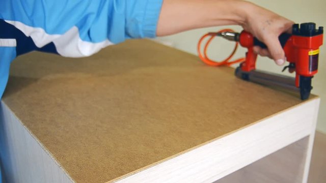 stapler staples nailed hardboard to furniture Video housing