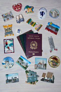  collection of various passports and souvenir magnets from several world country , Flat lay