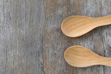 Wooden spoon on brown old wood table.