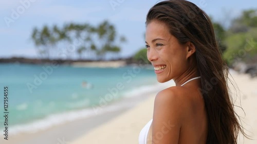 Beautiful Asian Bikini Woman Relaxing On Beach Blowing A Kiss At