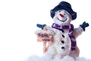 Little snowman figurine welcomes winter in the spotlight.