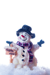 Little snowman figurine welcomes winter in the spotlight.