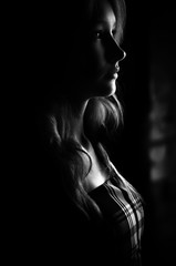 Girl in the darkness black and white portrait