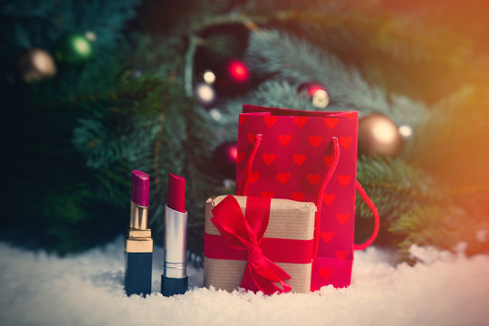 Shopping bags and christmas gifts with makeup lipstick