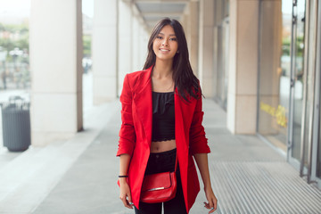 Beautiful young asian woman outdoors
