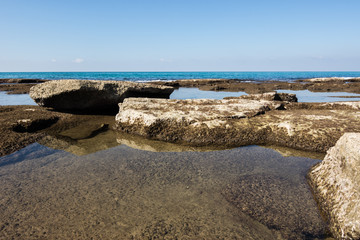 Kurkar sandstone formation at Nahariya Beach on a clear fall morning