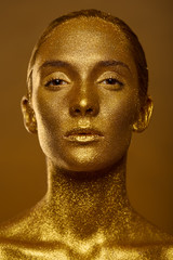 Close up portrait beautiful woman golden skin sparkles glitter