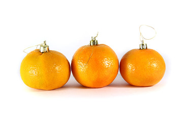 mandarins and Christmas decorations close-up on a white backgrou