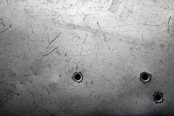 Scratched metal background with bullet holes - obrazy, fototapety, plakaty