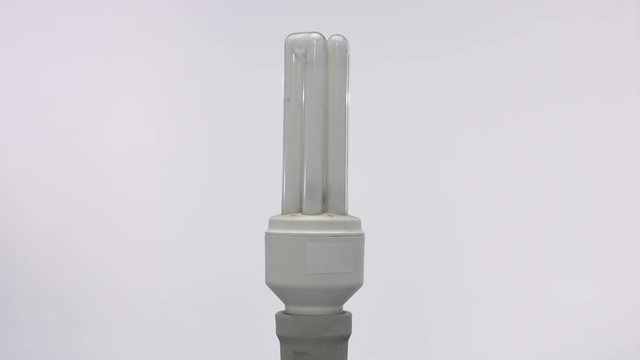 Rotating vertical triple tube energy saver on white background