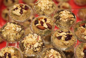 desserts made of cheese and almonds for sale in the stall of typ