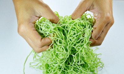 hand spread raw Chinese jade noodle prepare to cook