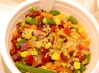 dish of boiled mixed vegetables and seeds of quinoa