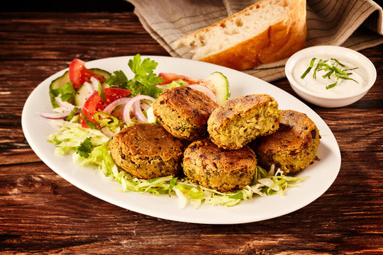 Serving of fried Turkish falafel patties and salad