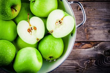 organic green apples in colander