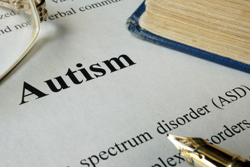 Autism spectrum disorder ASD written on a paper. - obrazy, fototapety, plakaty