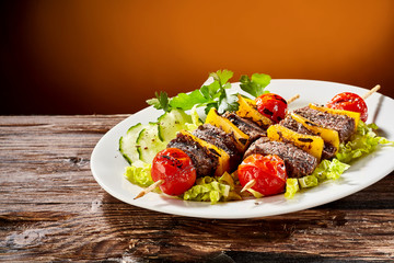 Tasty barbecued beaf steak shish kebabs