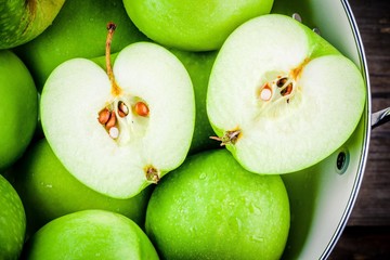 organic green apples in colander