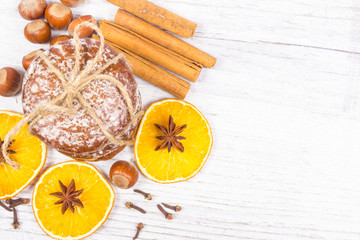 Gingerbread cookies, cinnamon and orange slices. Christmas decoration.