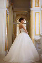 Obraz premium beautiful young woman bride in luxury wedding dress in interior
