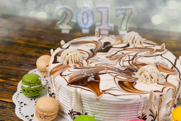 Cake for new year and christmas, candles number 2017 on backgrou