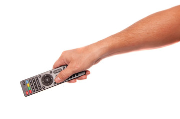Hand with remote control on white background.