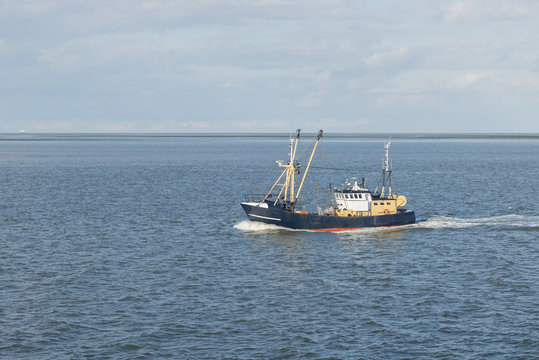 Fishing boat on the Wadden Sea .