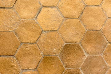 The cement floors make a hexagon and painted gold.