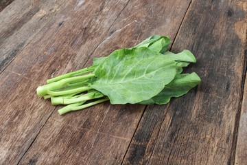 Chinese kale fresh vegetable on Wooden floor background