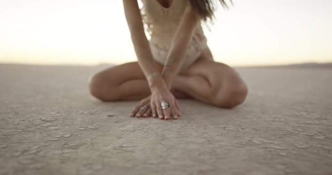 Exotic girl dancing in the desert