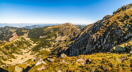 Valley and Mountain Landscape. Under Chopok Mount with Rocks in Foreground and Dumbier Mount in Background. Low Tatras, Slovakia.