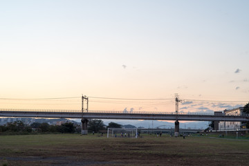 Fototapeta na wymiar Iron bridge, riverbed,Sunset,soccer, in Japan