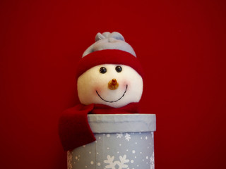 Snowman decoration on red background