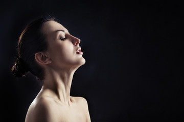 sensual aroused woman profile on black background with copyspace
