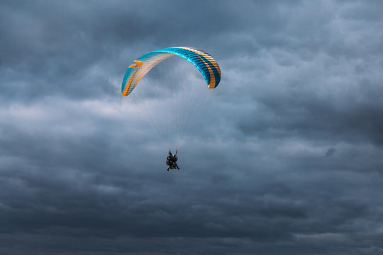 Paraglider in the blue dark sky