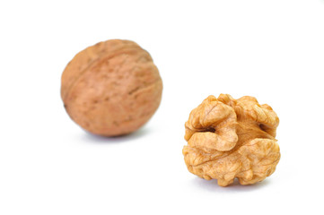 Cracked walnut isolated on white.