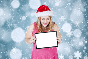 Christmas woman holding blank board