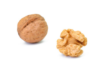 whole and cracked walnut isolated on the white background
