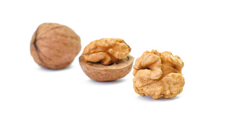 pieces of walnuts on white background