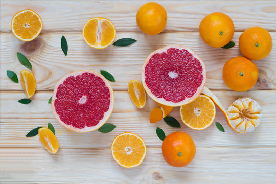 background of fruits mandarin and grapefruit on a table