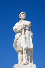 Fototapeta na wymiar Statue to the unknown soldier in Agia Stratiota Square (Agnostou Square), Rethymno, Crete, Greece.