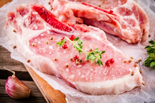 fresh raw meat of pork on a dark background