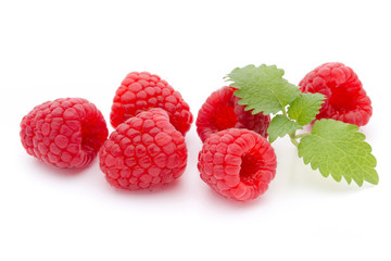Ripe raspberry with leaf isolated on the white background.
