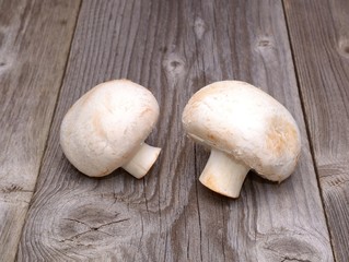 Champignon on wooden background