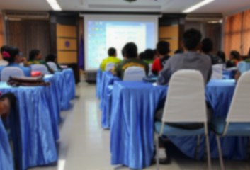 blurred focus, student learning business sitting in classroom with teacher front 