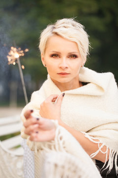 beautiful woman holding sparklers