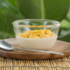 cornflakes with milk on the  cup