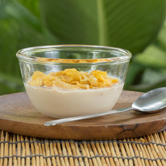 cornflakes with milk on the  cup