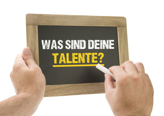 Was sind Deine Talente? / Hand schreibt auf Tafel