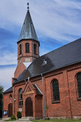 Fototapeta na wymiar Gothic parish church with belfry in Poland.